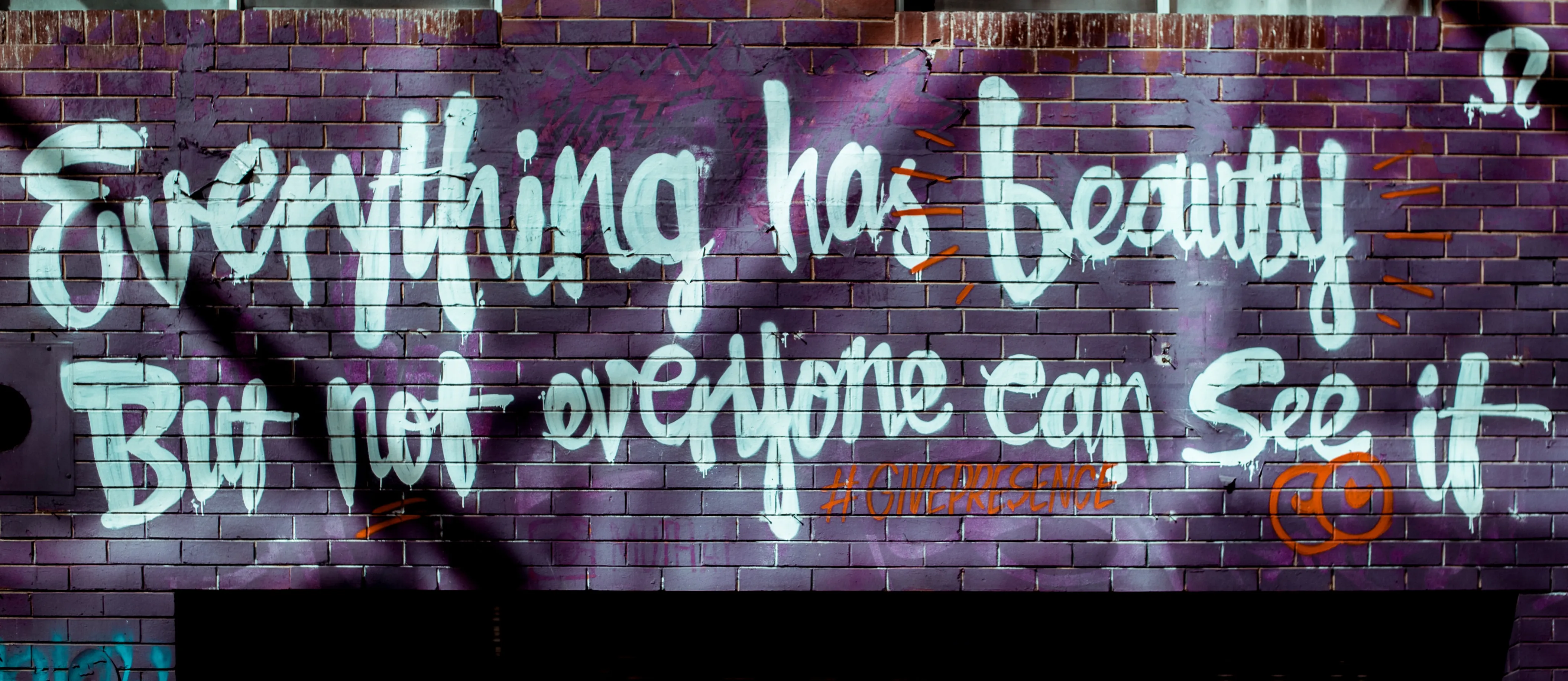 Graffiti on Brick Wall Says Everything Has Beauty but Not Everyone Can See It